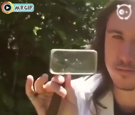 کشیدن نقاشی با نور آفتاب و ذره بین 